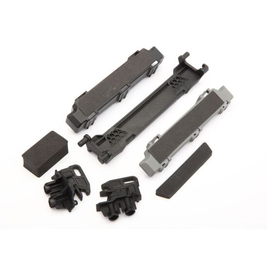 Battery hold-down/ mounts (front & re ar)/ battery compartment spacers/ foa m pads
